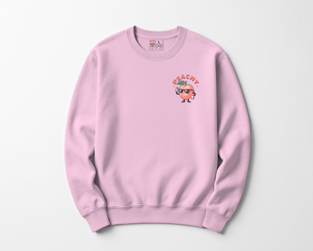 Pink sweatshirt with a Peachy character and text 