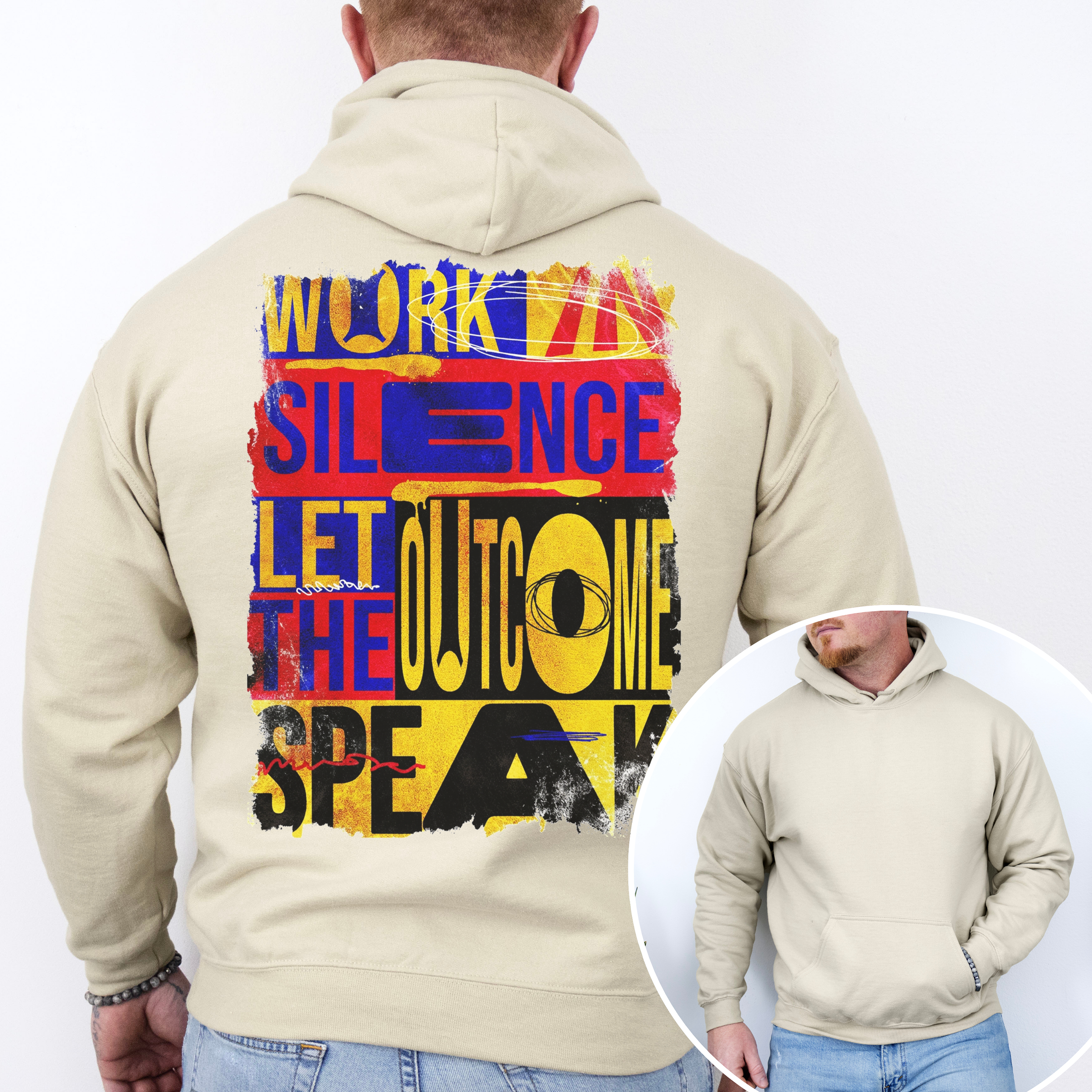 Beige hoodie with colorful text design on the back, worn by a person.